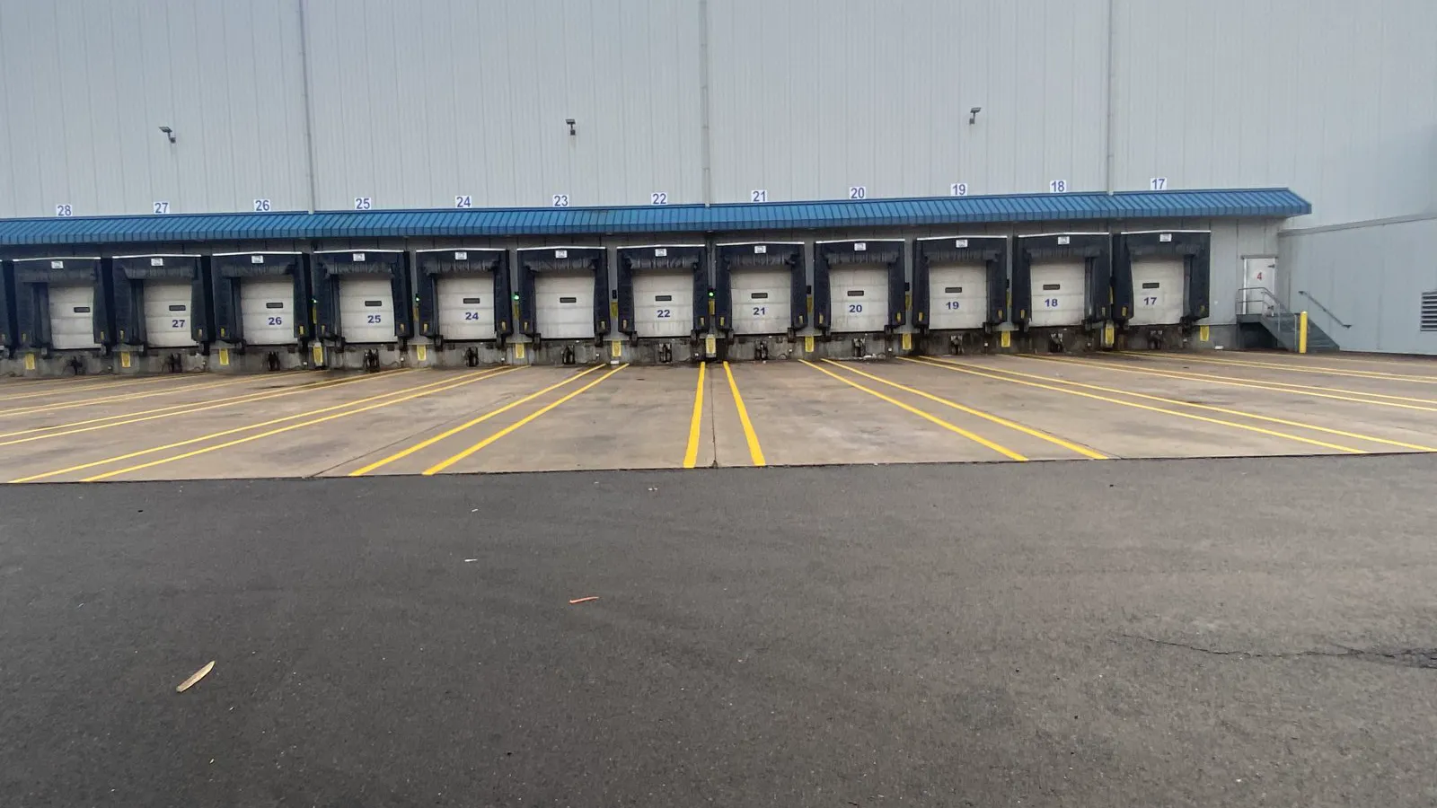 Empty striped loading dock lanes at a Connecticut warehouse on striping day